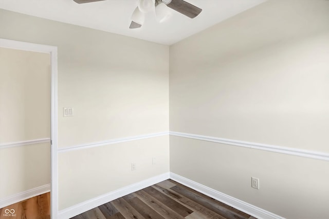 spare room featuring ceiling fan and dark hardwood / wood-style floors