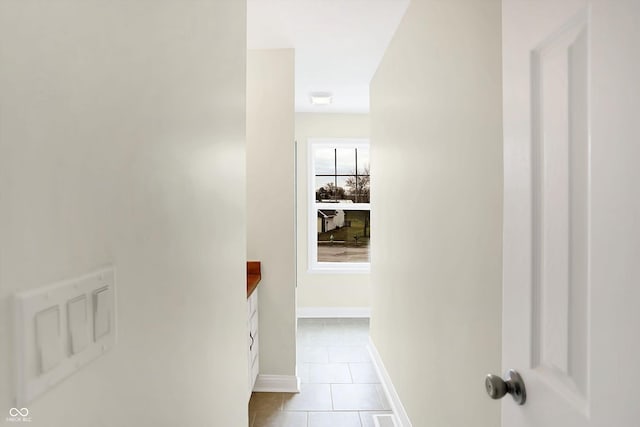 hallway featuring light tile patterned floors