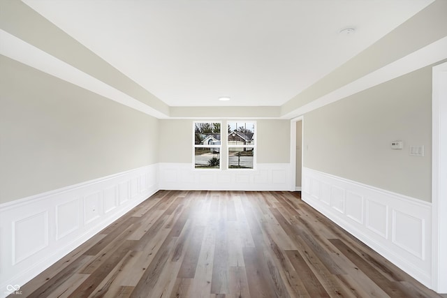 spare room featuring dark wood-type flooring