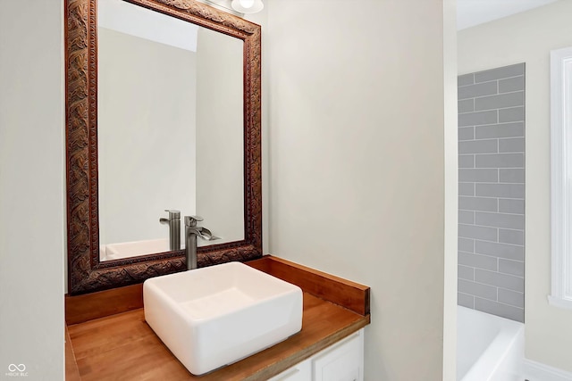 bathroom featuring tile patterned flooring and vanity