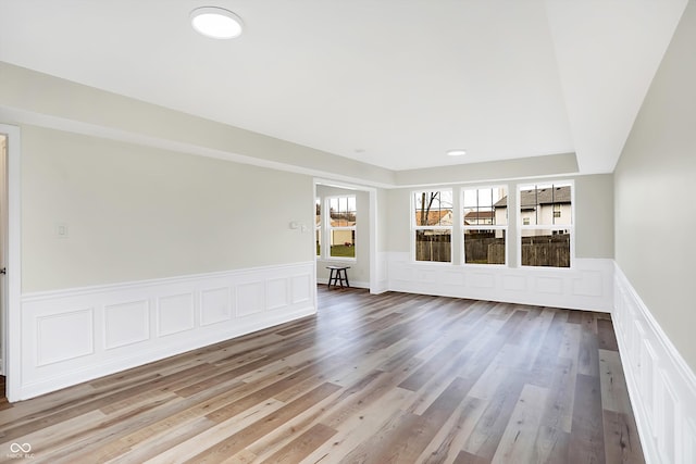 unfurnished room with wood-type flooring