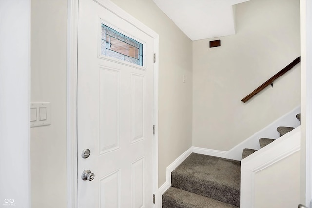 foyer featuring carpet flooring