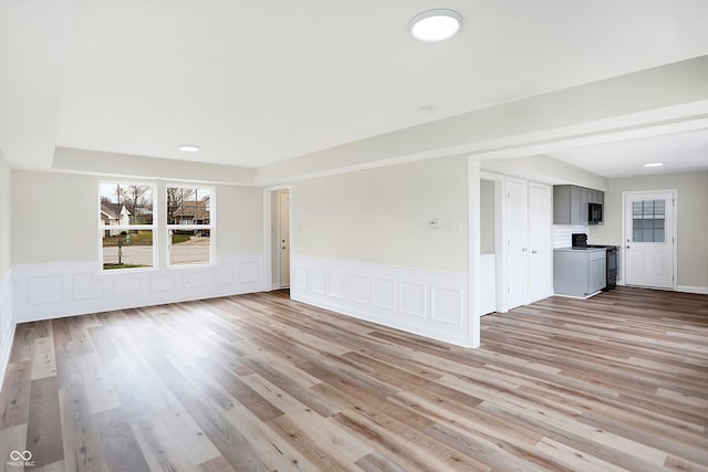 unfurnished living room featuring light wood-type flooring