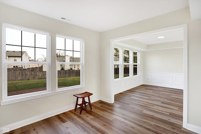 unfurnished room with wood-type flooring