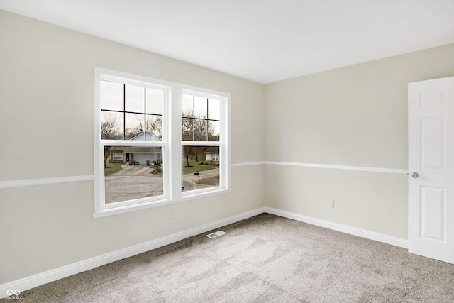 view of carpeted spare room