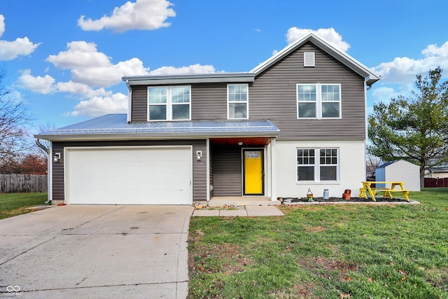 view of property with a garage and a front yard