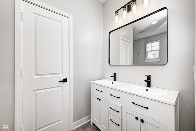 bathroom featuring hardwood / wood-style floors and vanity