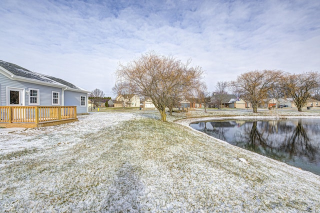 view of yard featuring a deck with water view