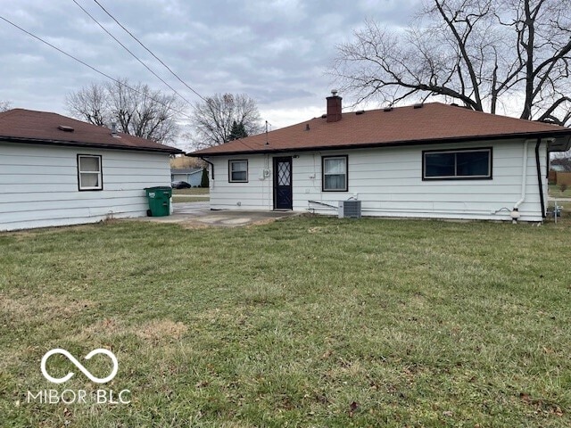 back of house with a yard, a patio, and cooling unit