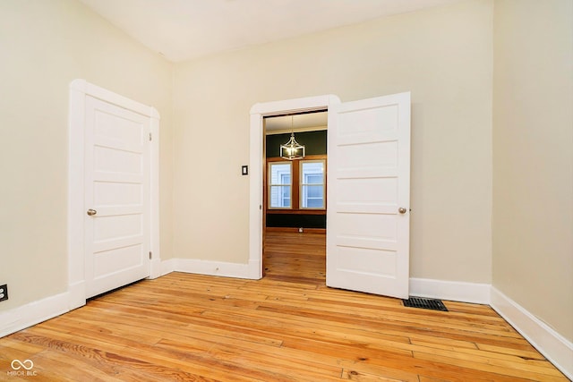 empty room featuring wood-type flooring