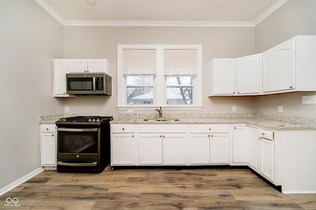 kitchen with white cabinets, black stove, wood-type flooring, and sink