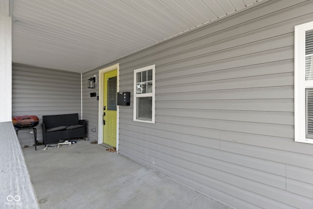 view of patio with a grill and covered porch