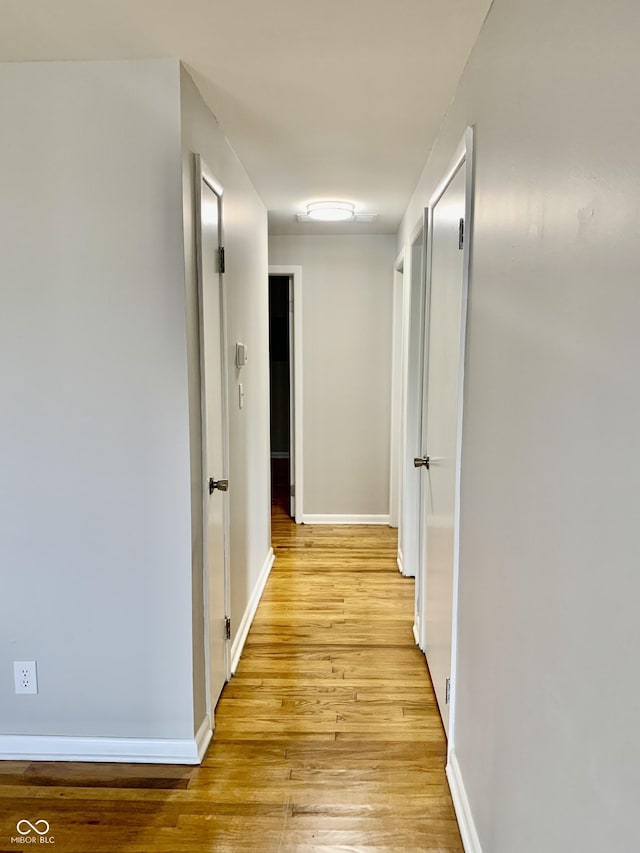 hallway featuring light wood-type flooring