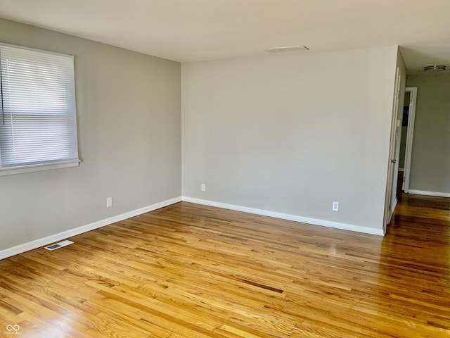 spare room featuring light wood-type flooring