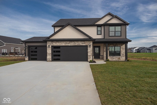 craftsman house with a garage and a front lawn