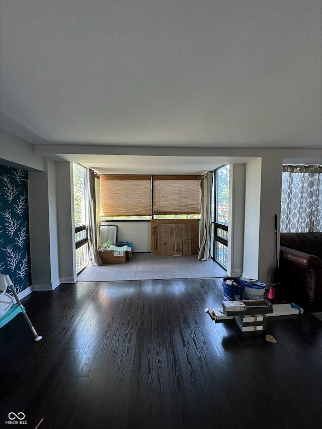 unfurnished living room featuring light hardwood / wood-style flooring and a healthy amount of sunlight