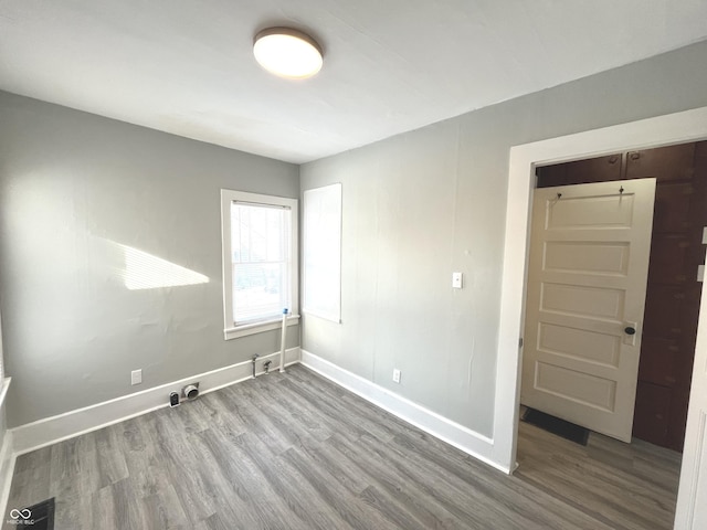 spare room with hardwood / wood-style flooring