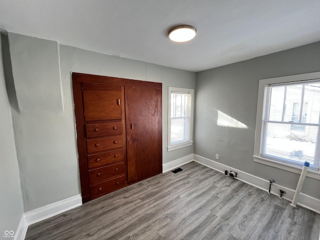 unfurnished bedroom with light hardwood / wood-style flooring