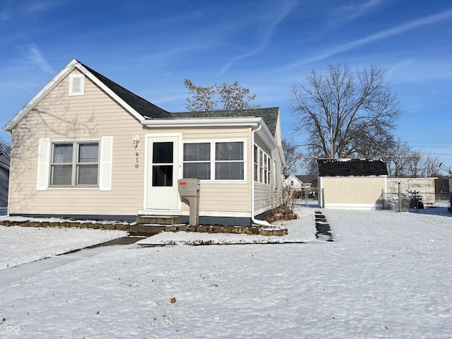 view of front facade featuring a shed