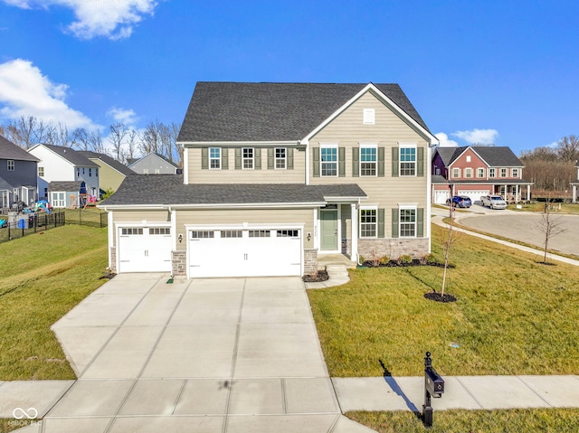 view of front of house with a garage and a front lawn