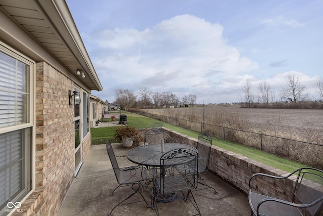 view of patio / terrace with a rural view