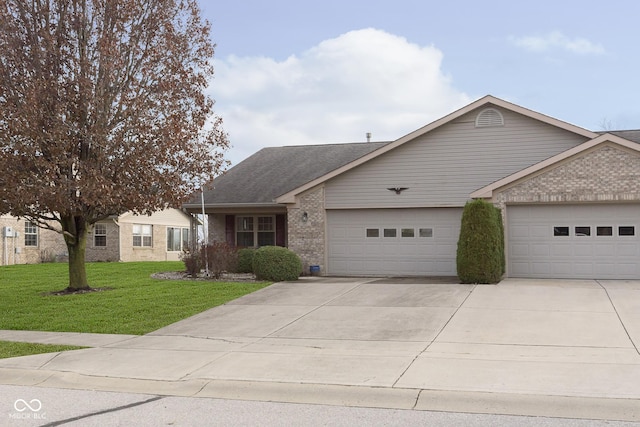 single story home with a garage and a front lawn