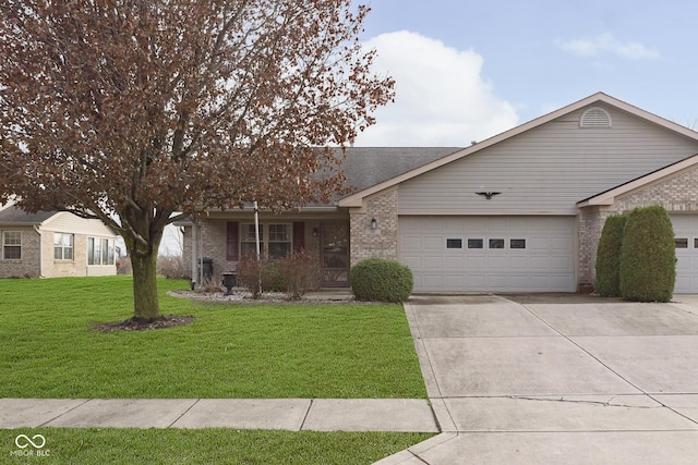 ranch-style house featuring a front yard and a garage