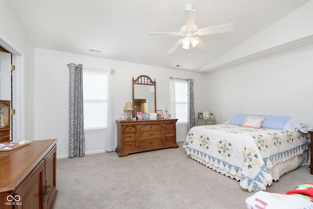 carpeted bedroom featuring ceiling fan and vaulted ceiling