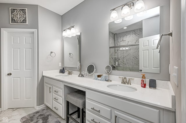 bathroom with vanity and a shower with shower door