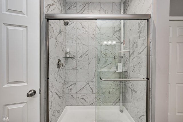 bathroom featuring an enclosed shower