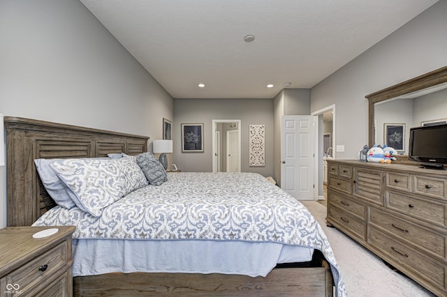 bedroom with light colored carpet