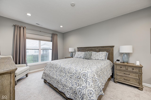 bedroom with light carpet