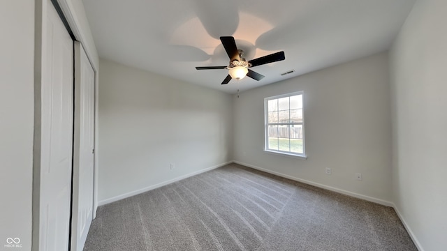 unfurnished bedroom featuring a closet, baseboards, visible vents, and carpet flooring