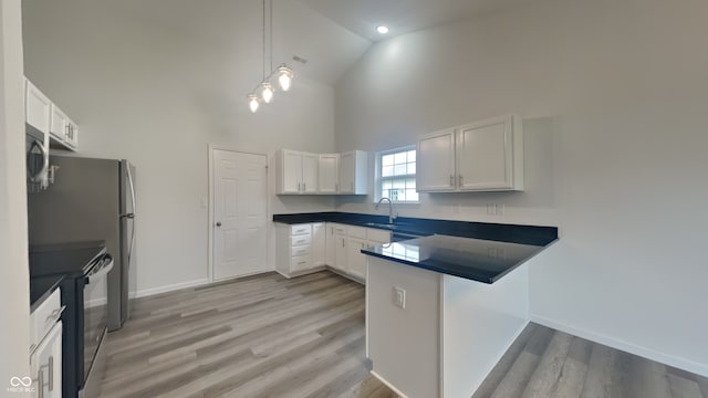 kitchen with white cabinetry, black stove, high vaulted ceiling, and sink