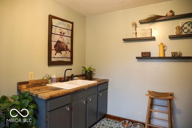 bathroom featuring vanity and a textured ceiling