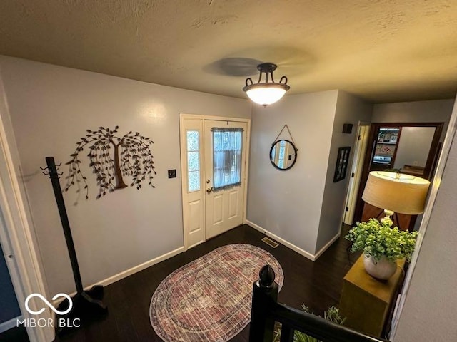 entrance foyer with dark hardwood / wood-style flooring