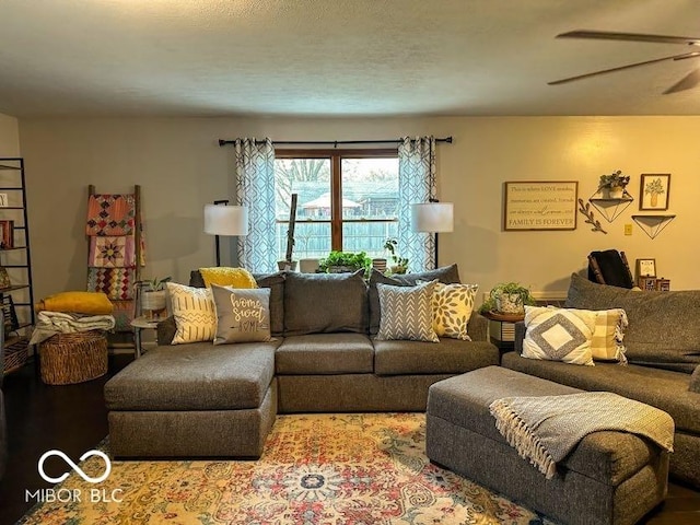 living room with hardwood / wood-style flooring and ceiling fan