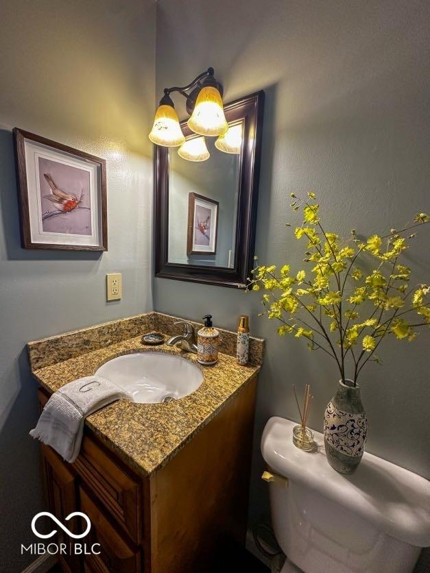 bathroom with vanity and toilet