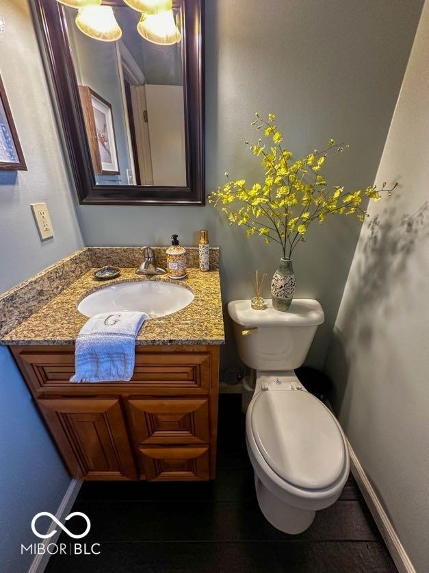 bathroom with tile patterned floors, vanity, and toilet