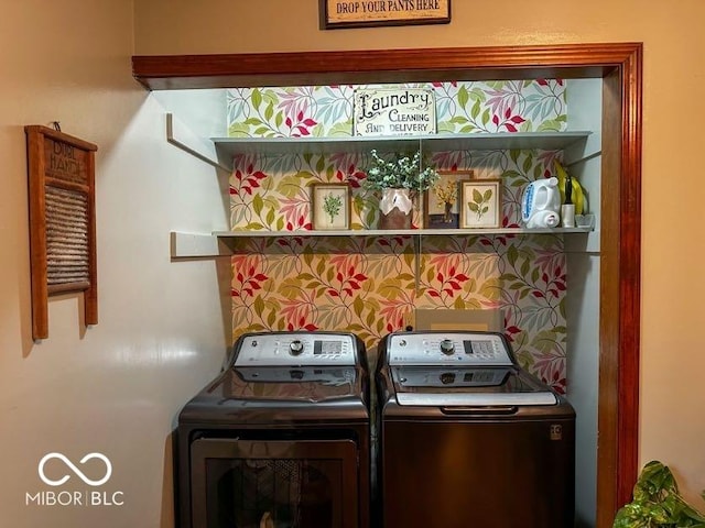 clothes washing area with independent washer and dryer