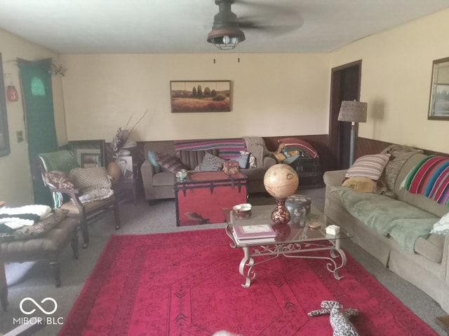 living room with ceiling fan and carpet floors