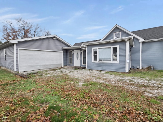 single story home featuring a garage