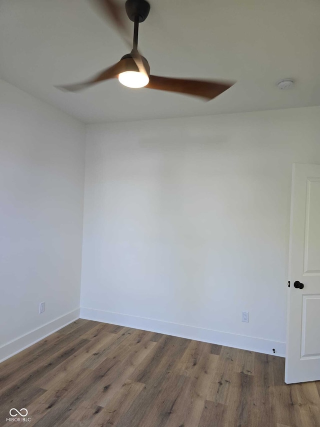 empty room featuring dark wood-type flooring