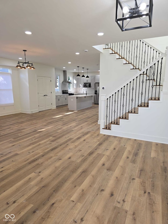 unfurnished living room with hardwood / wood-style flooring