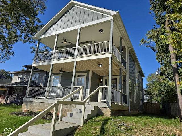 view of front of home with a front yard, a porch, and a balcony