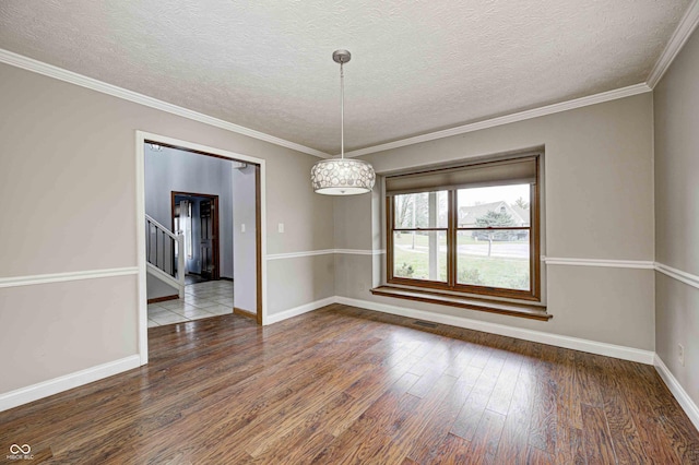 interior space with crown molding, wood-type flooring, and a textured ceiling