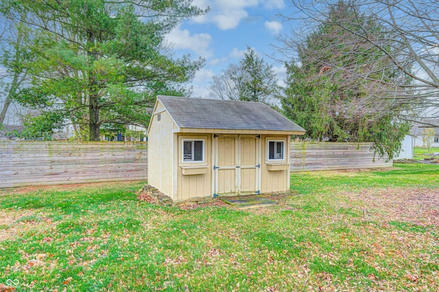 view of outdoor structure featuring a lawn