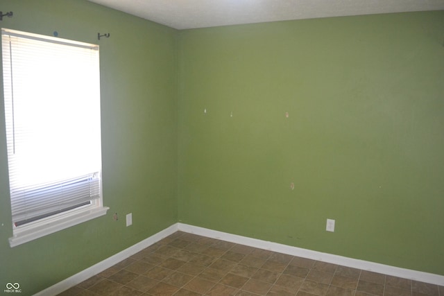 unfurnished room featuring a textured ceiling