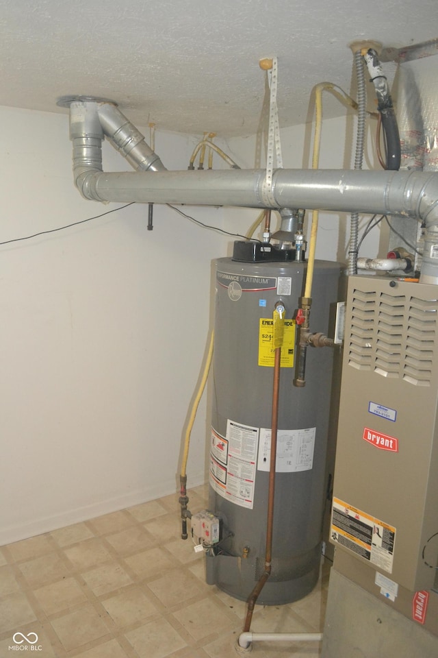 utility room featuring heating unit and gas water heater