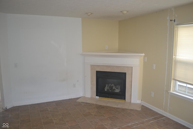 interior space with a tile fireplace